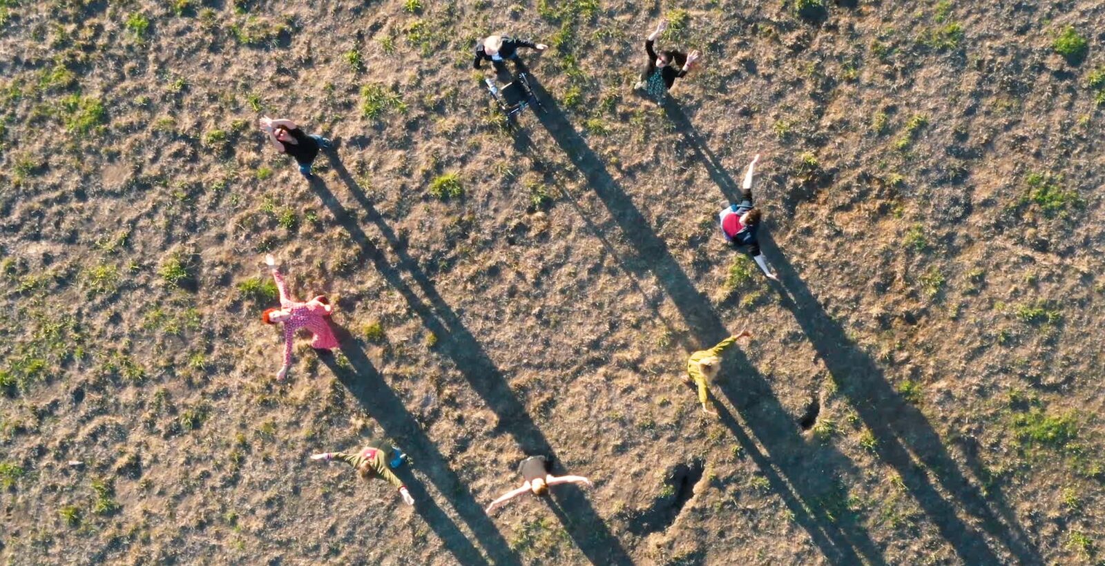 Overhead view of participants casting long shadows on the ground